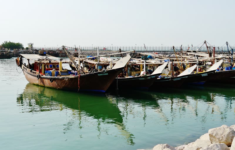 Wooden dhows beside the Kuwait City waterfront